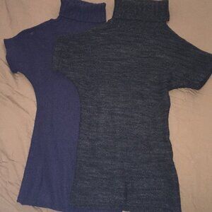 Two turtle neck long short-sleeved sweaters.